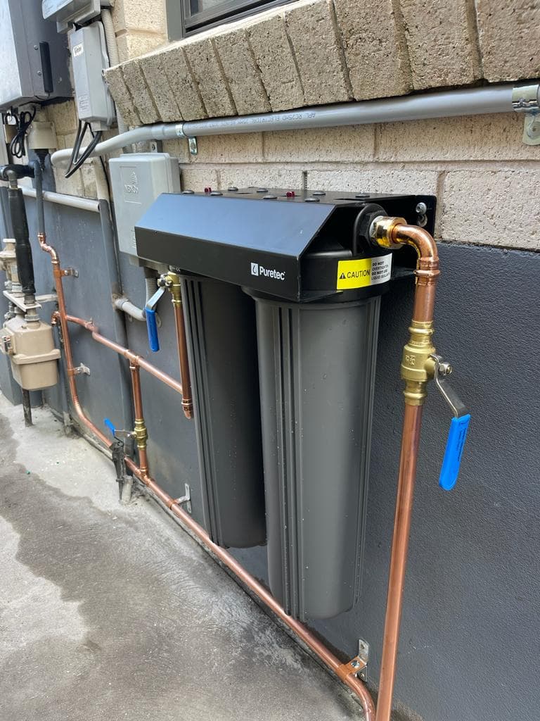 Active plumbing job site in Hills District