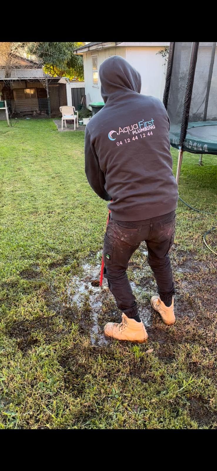 Professional plumber on site at a Hills District home performing repairs